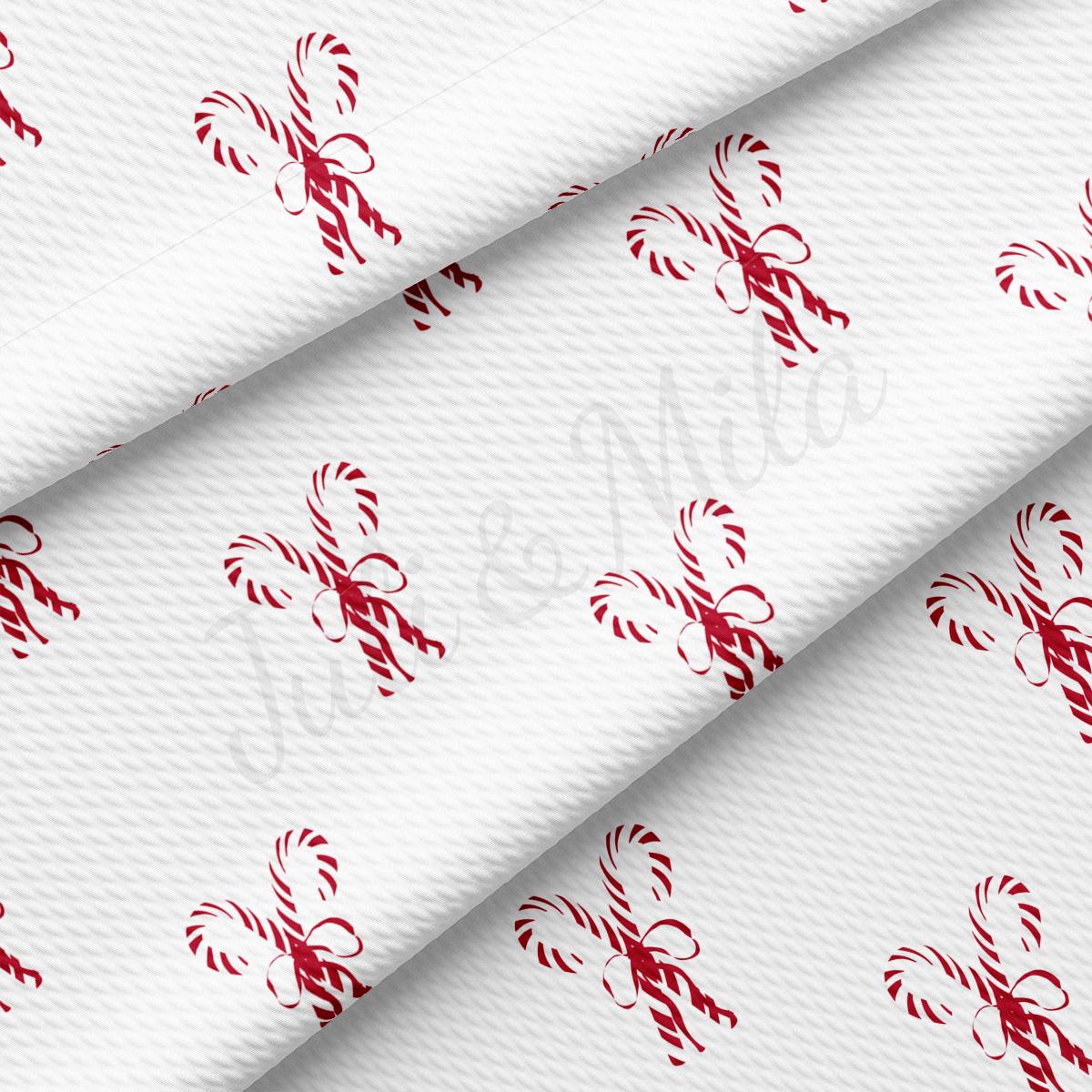 a white fabric with a red design on it