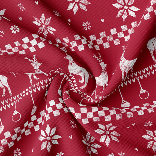 a red fabric with white snowflakes and reindeers