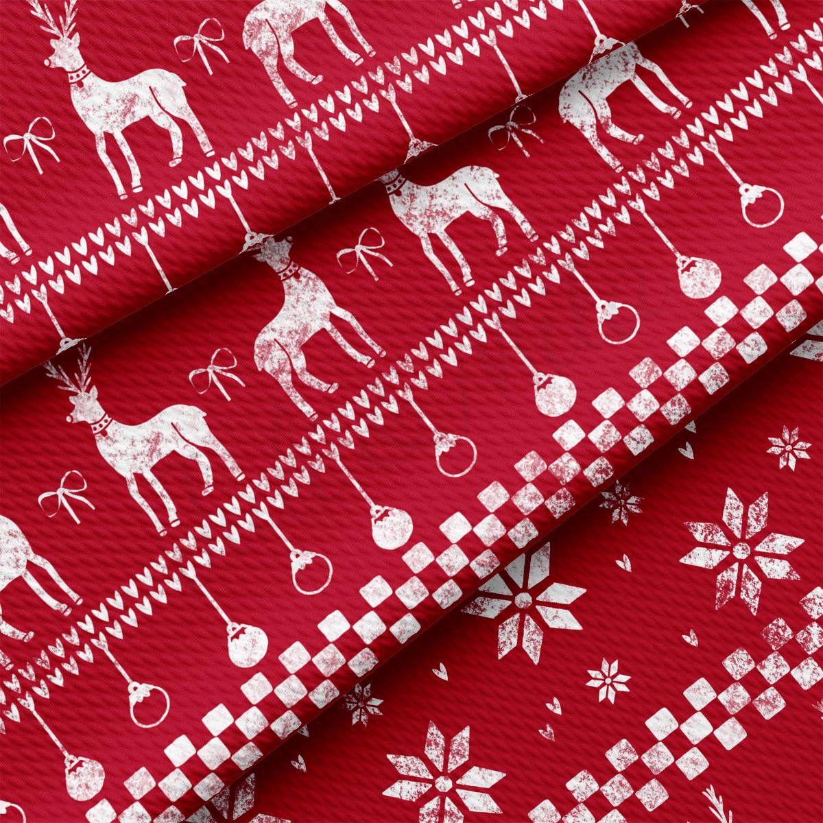 a red fabric with white reindeers and snowflakes