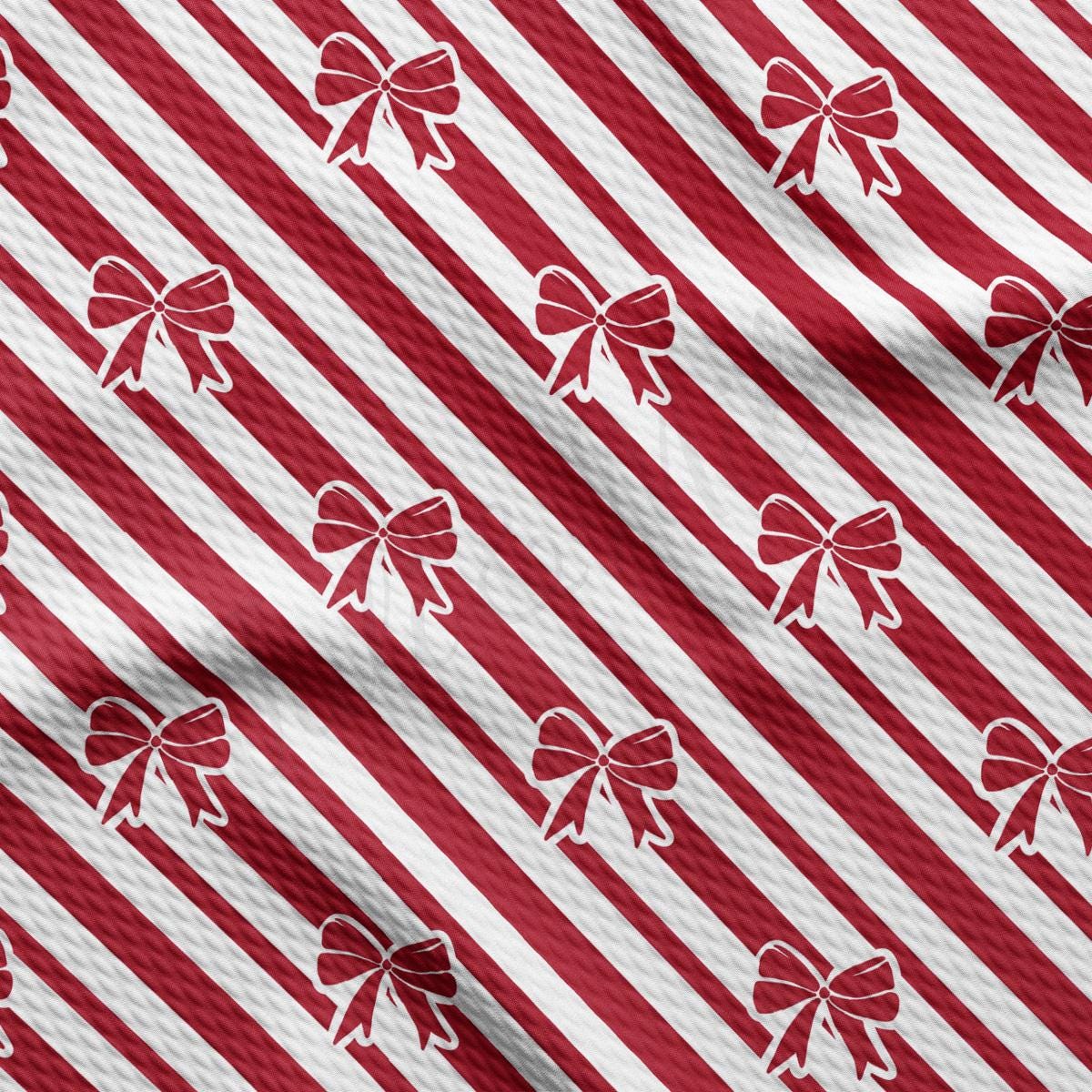 a red and white striped pattern with bows