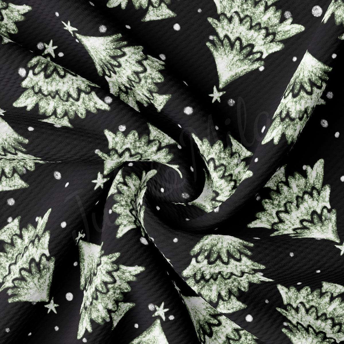 a green and white christmas tree print on a black background