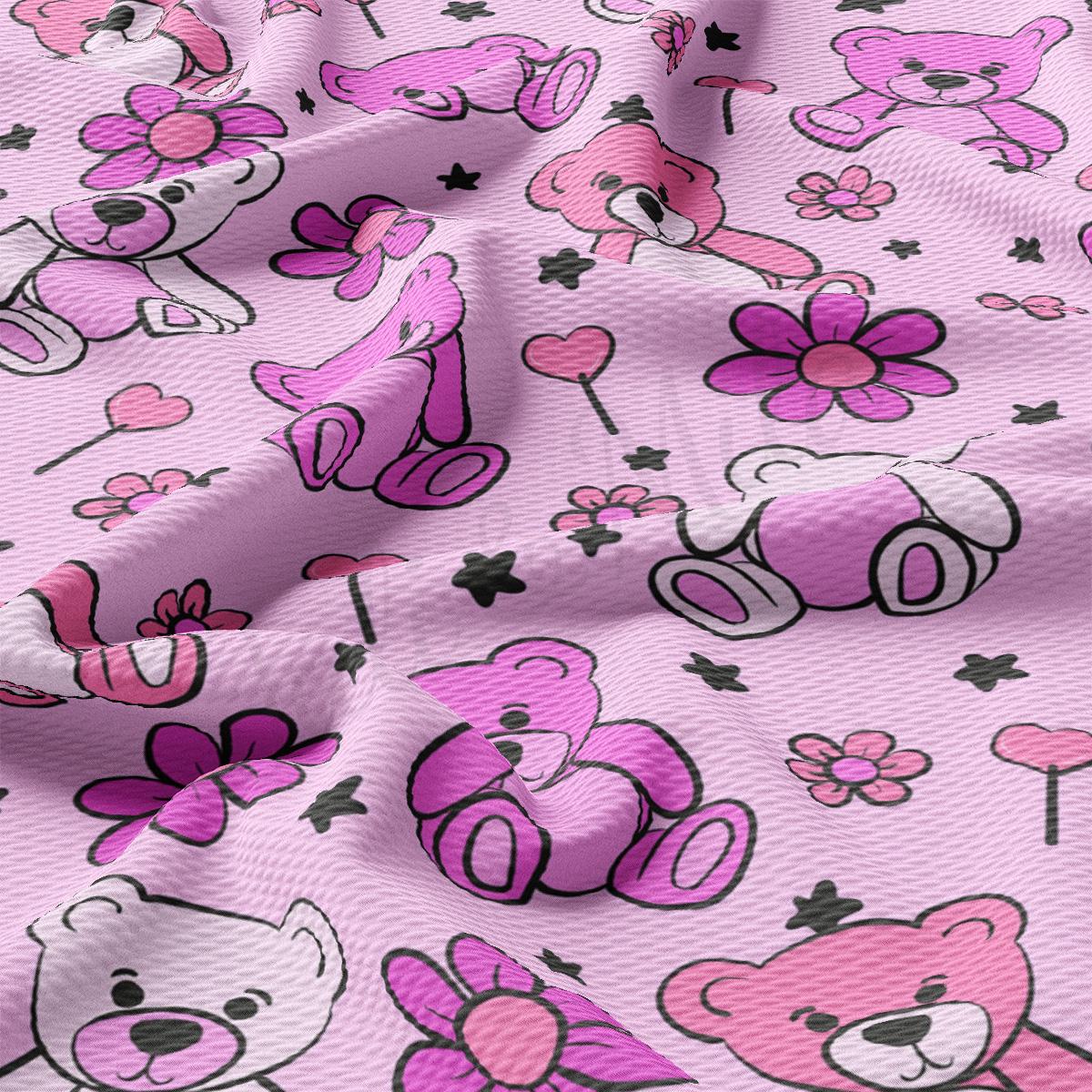 a pink fabric with pink teddy bears on it