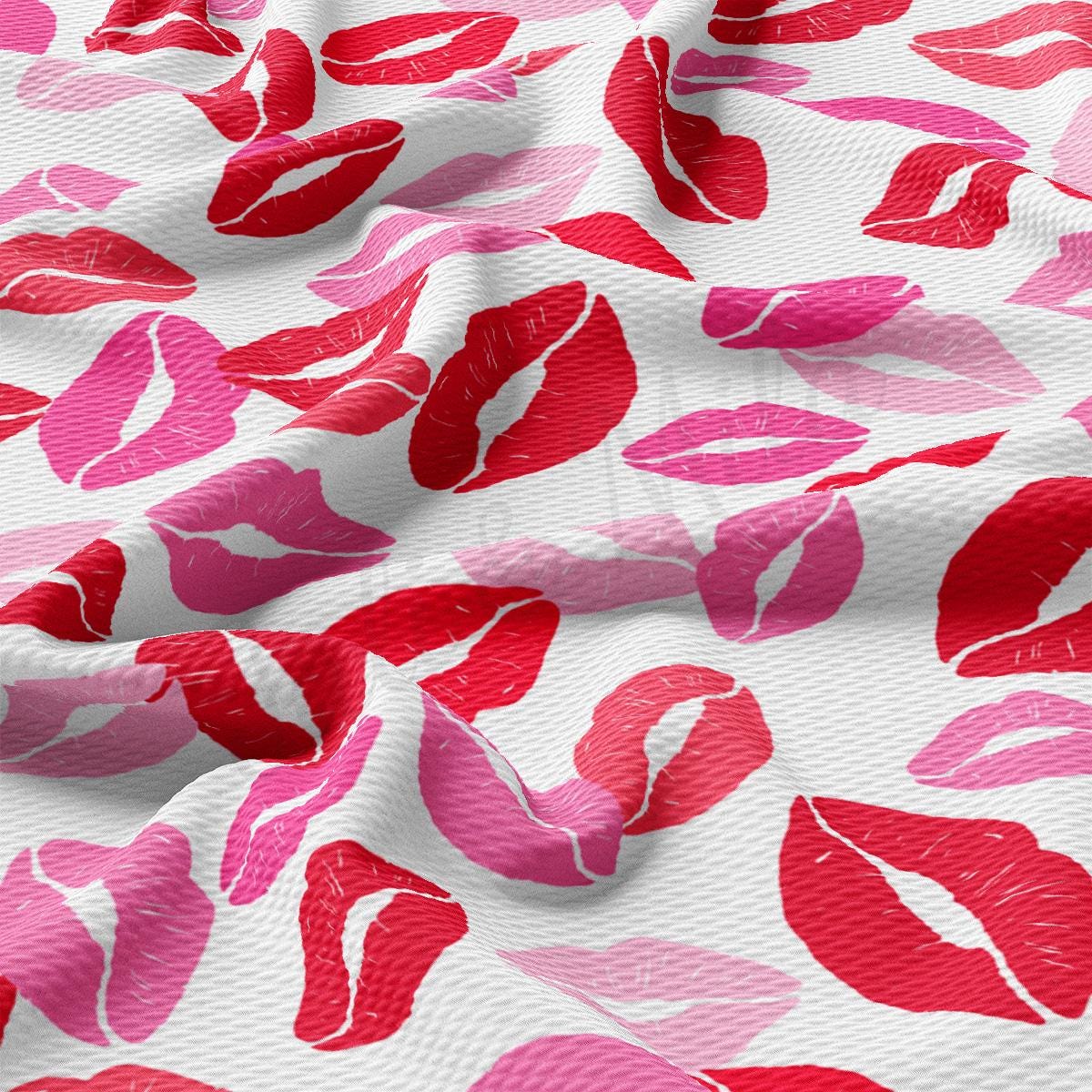 a close up of a pink and red lipstick print fabric