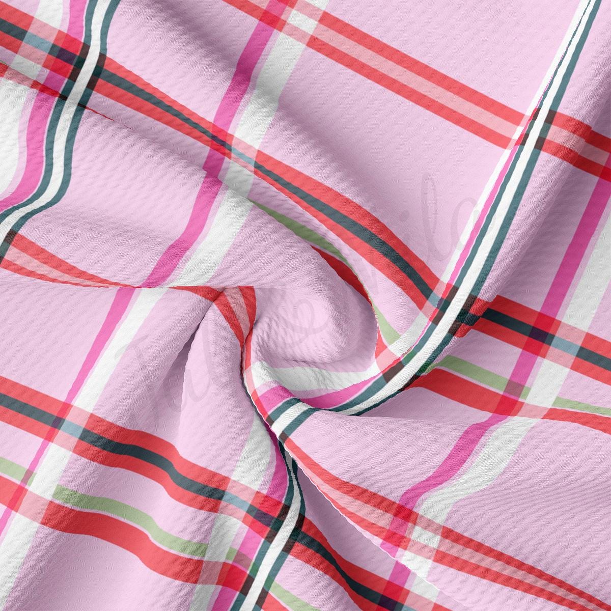 a close up of a pink plaid fabric