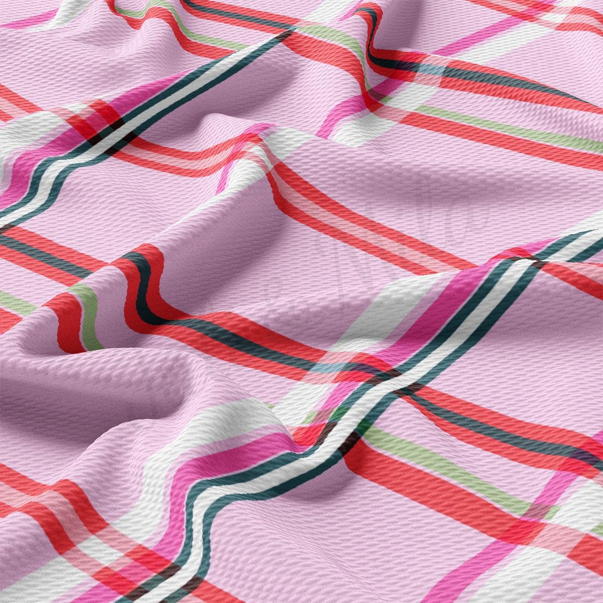 a close up of a pink plaid fabric