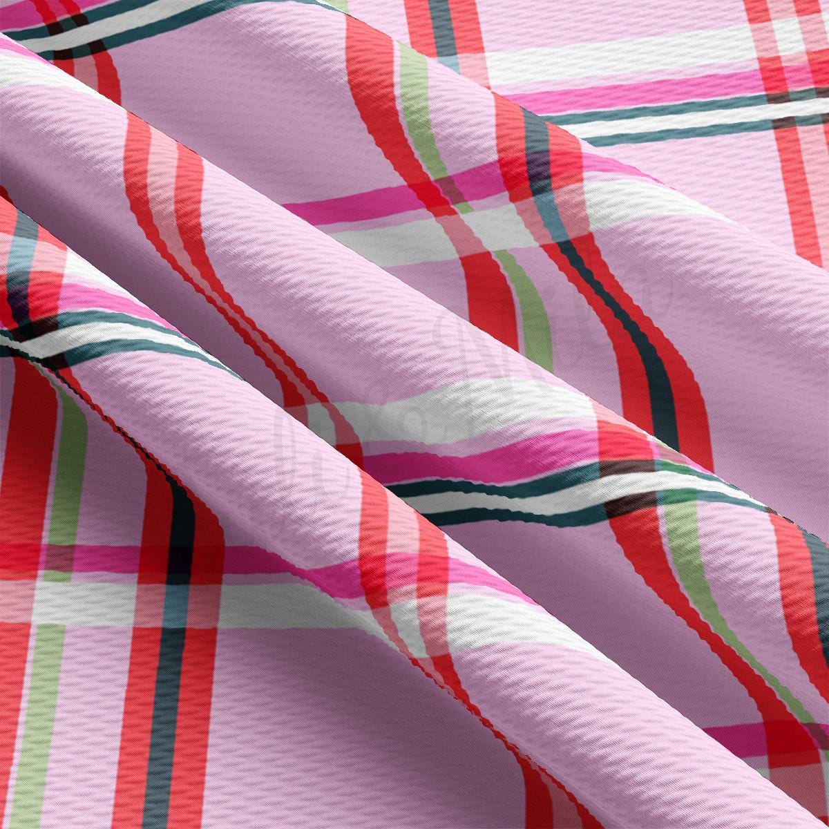 a close up of a pink plaid fabric