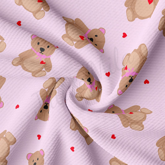 a pink fabric with teddy bears on it