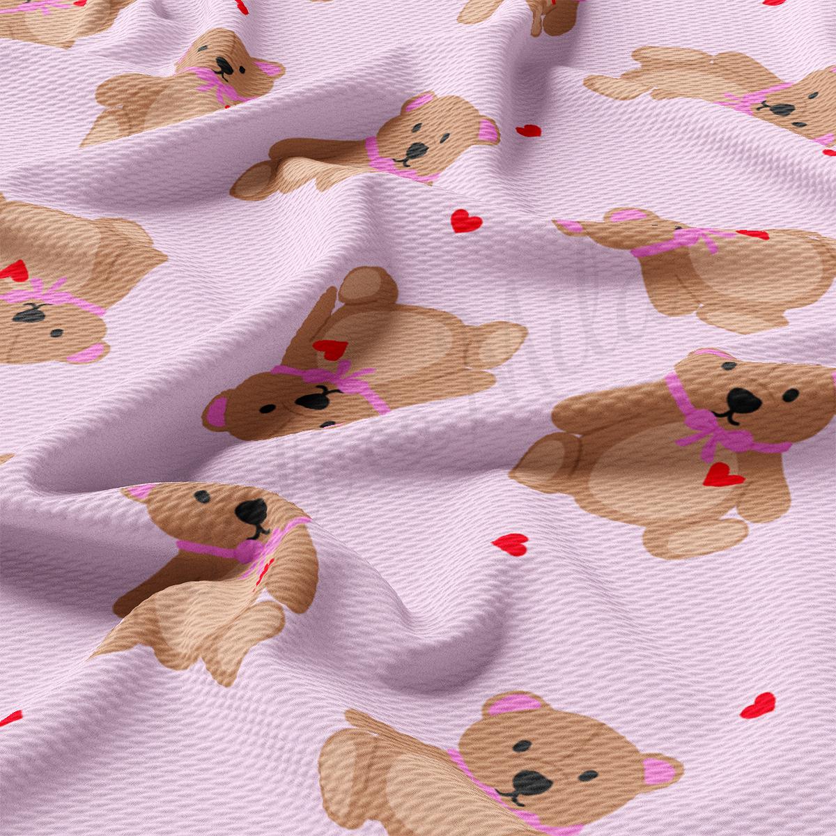 a pink fabric with brown teddy bears on it