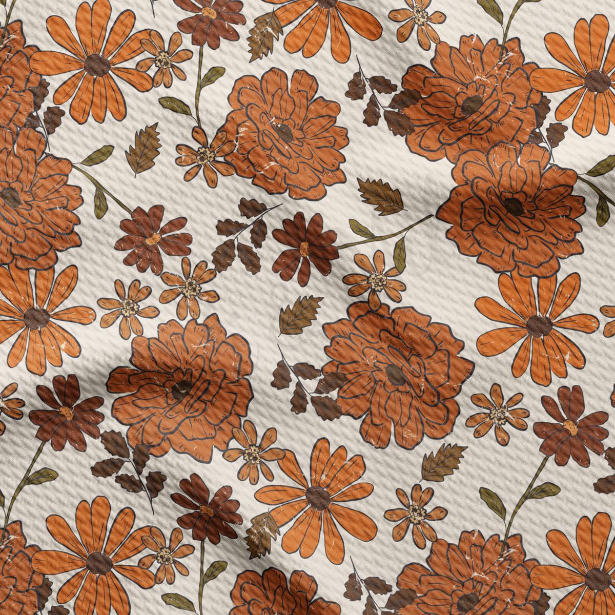 an orange and brown flower pattern on a white background