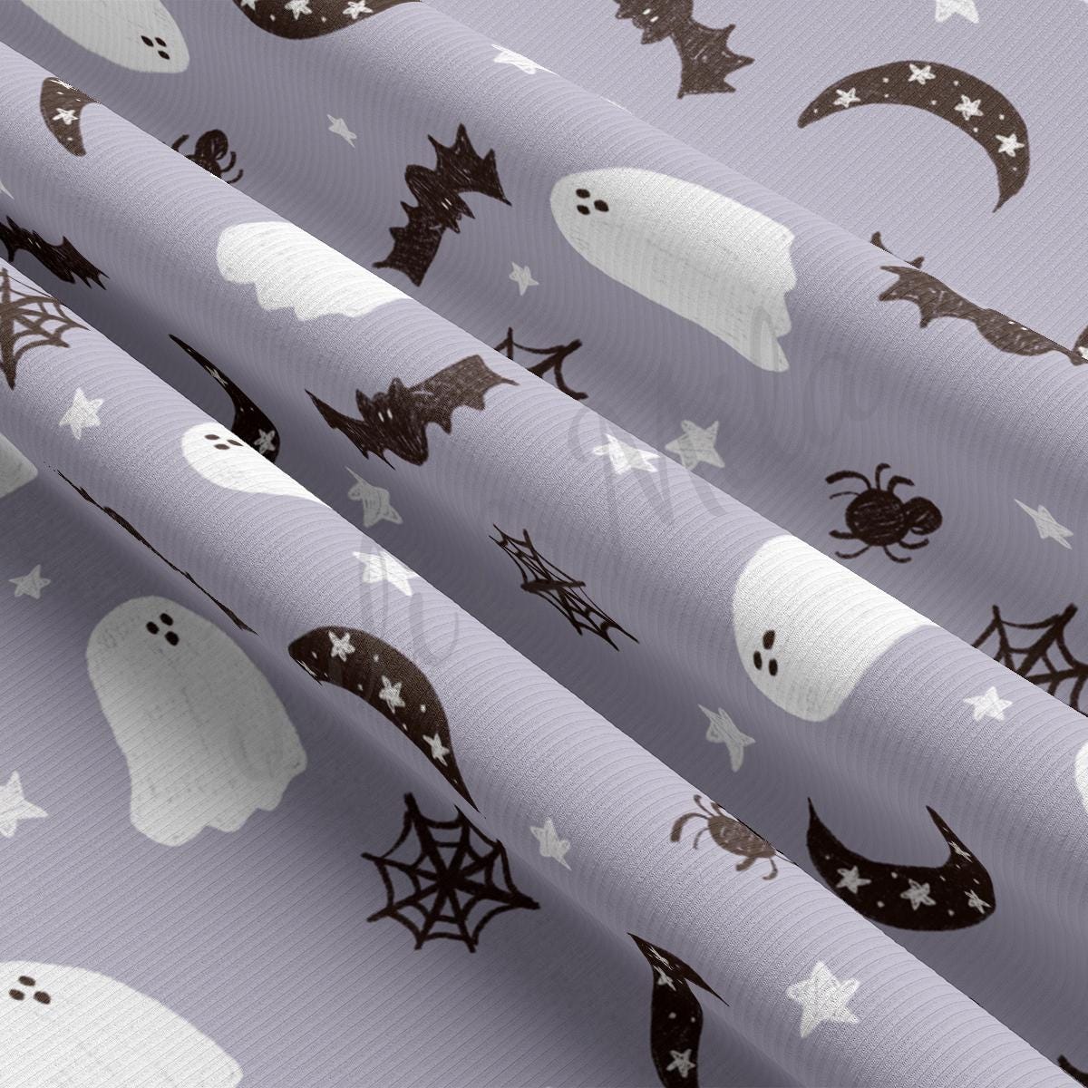 a close up of a curtain with ghost and stars on it