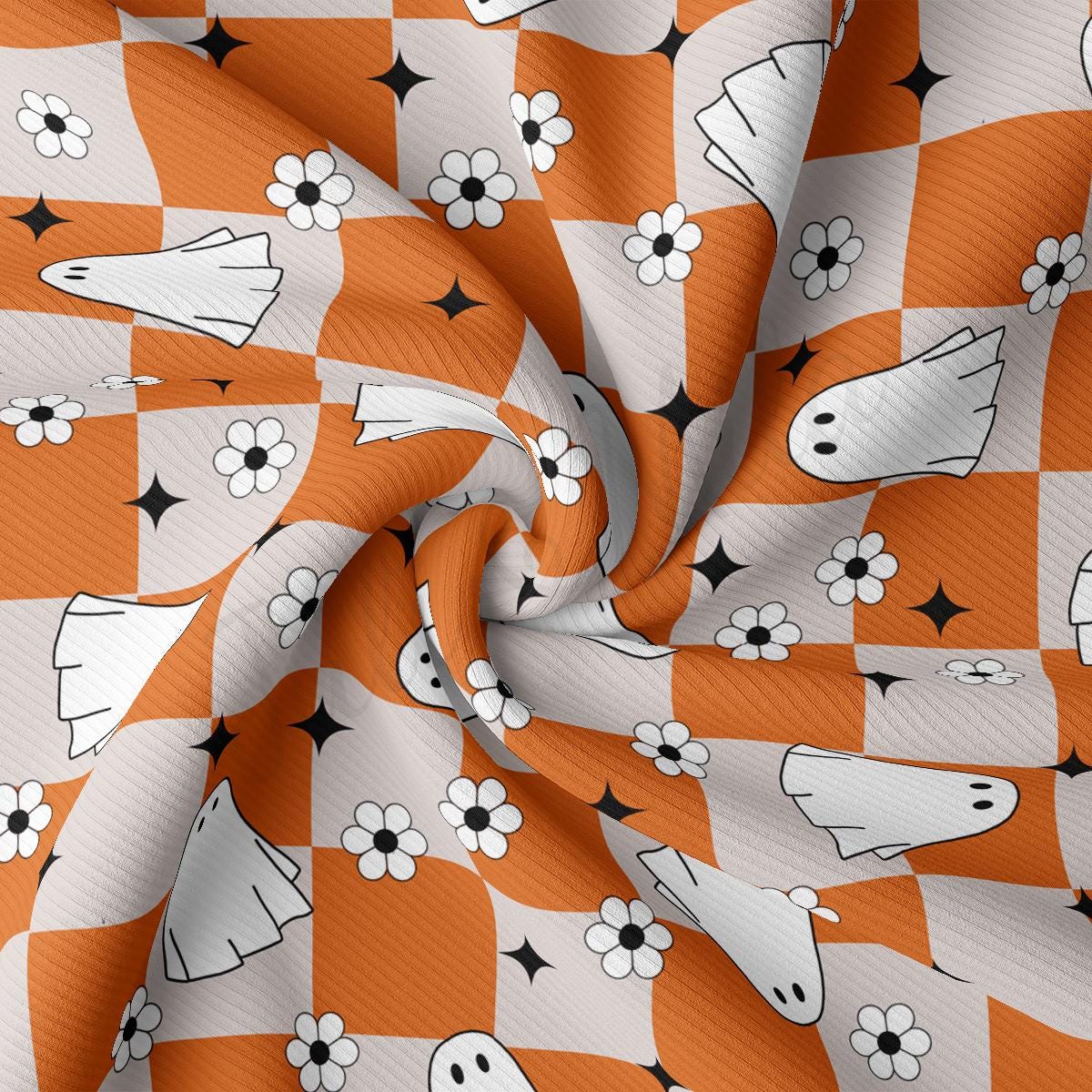 an orange and white checkered fabric with black stars