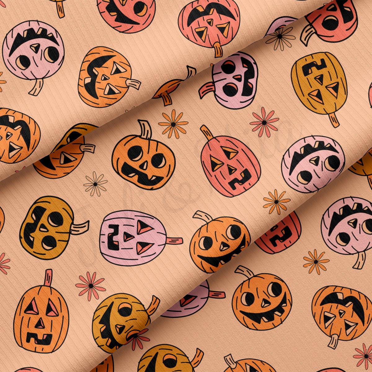 a close up of a pattern of pumpkins