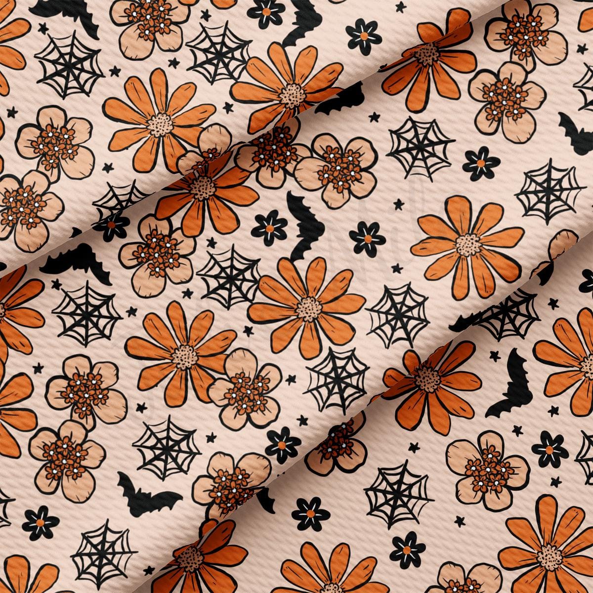 an orange and black flower pattern on a white background