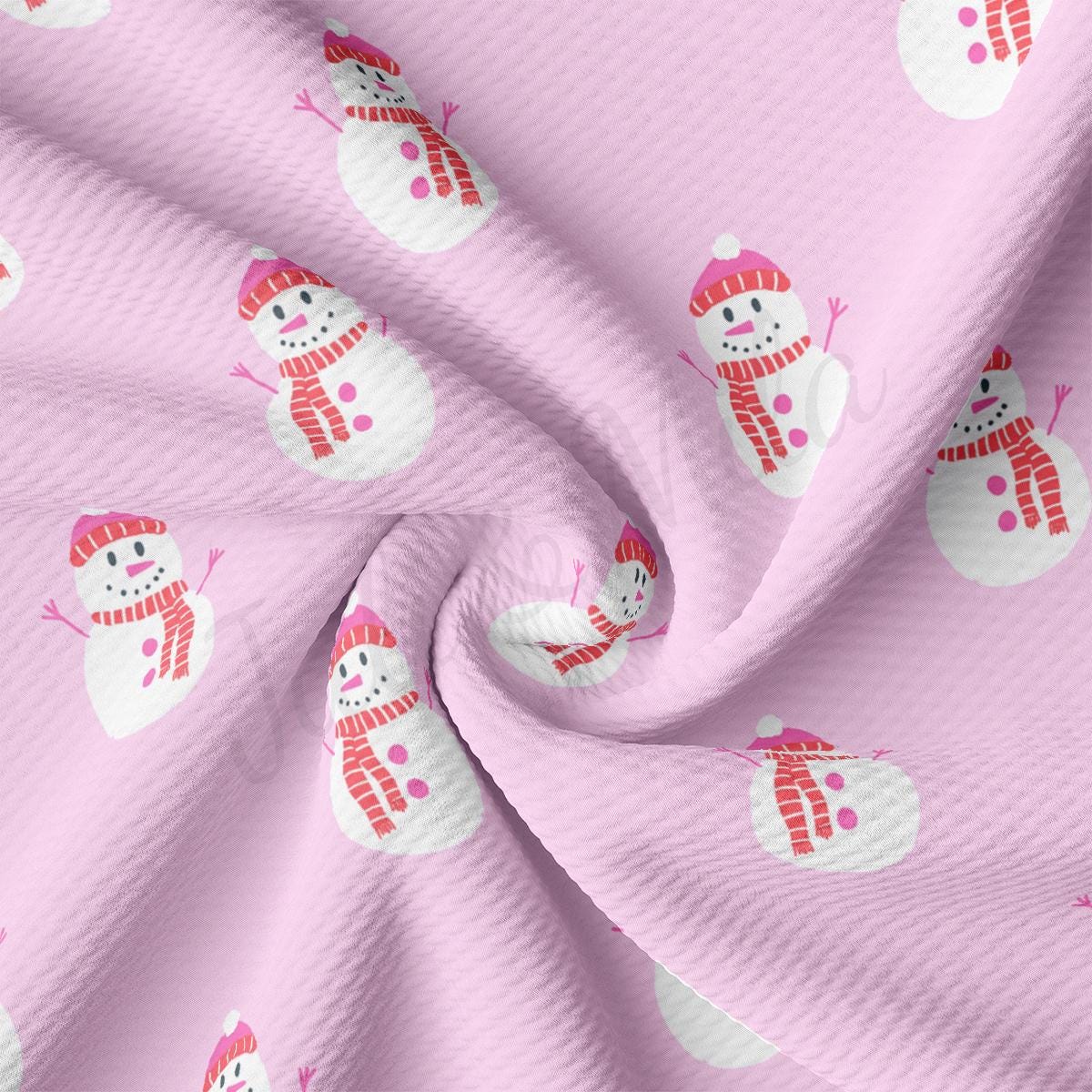 a pink fabric with snowmen on it