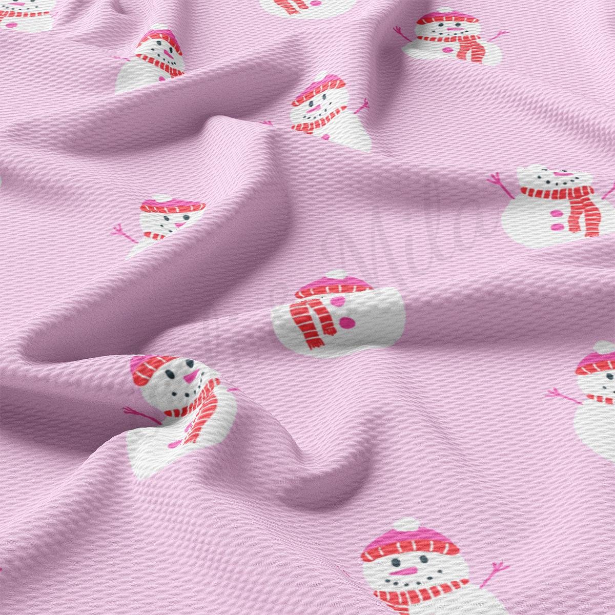 a pink fabric with snowmen on it