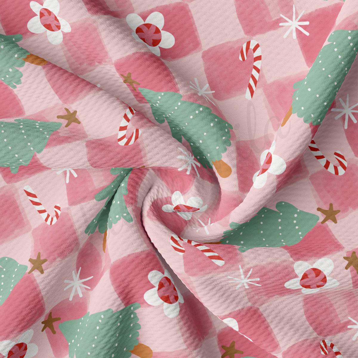 a pink and green checkered fabric with candy canes