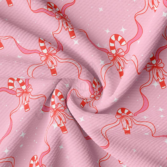 a pink background with candy canes and stars