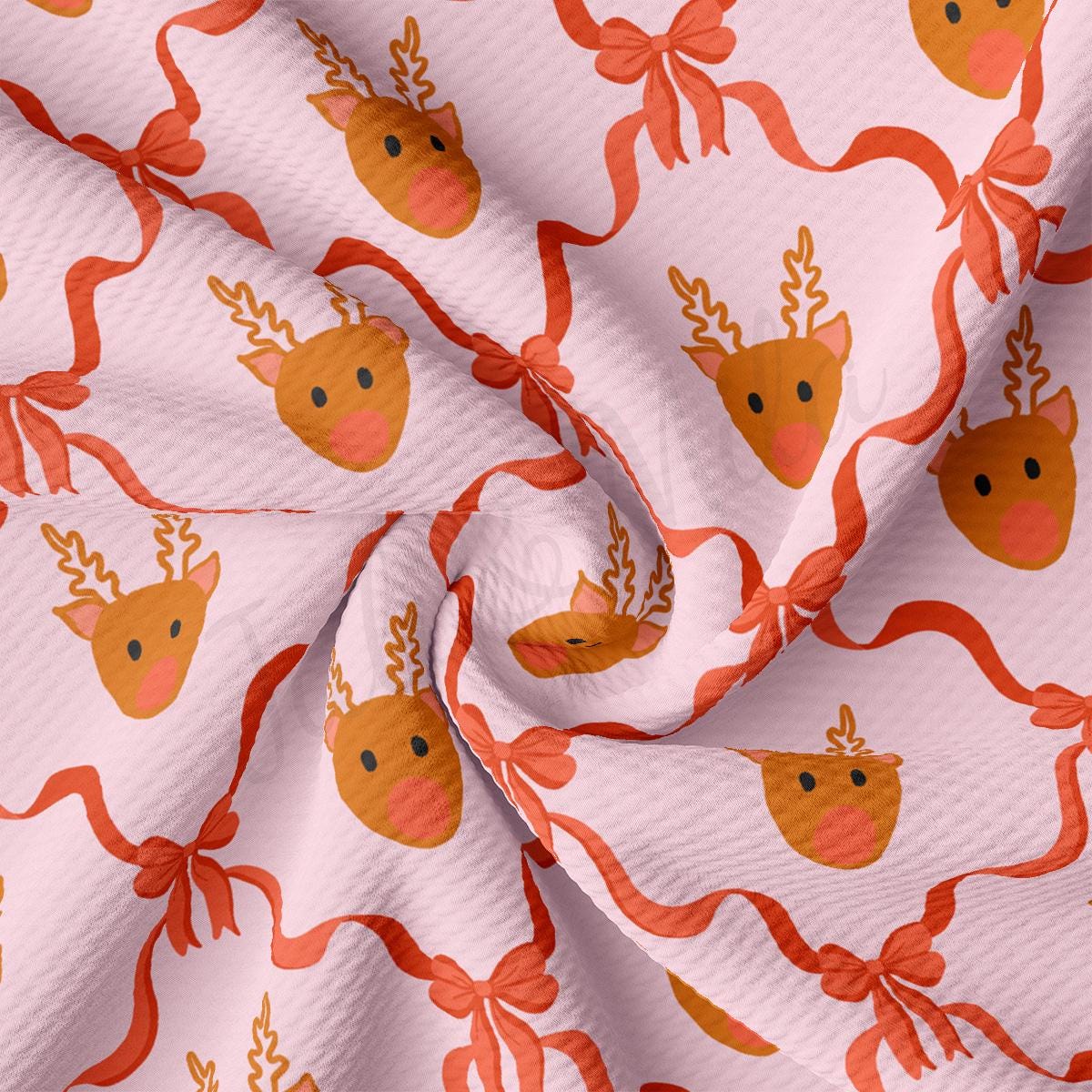 a close up of a pink fabric with a deer pattern