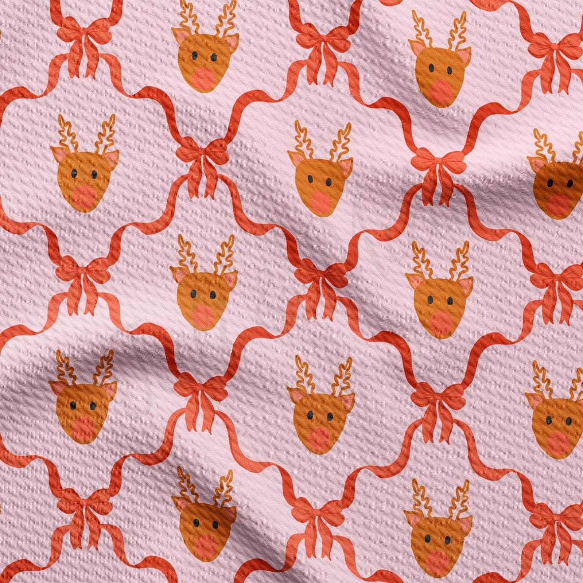 a pink background with a pattern of deer heads and bows