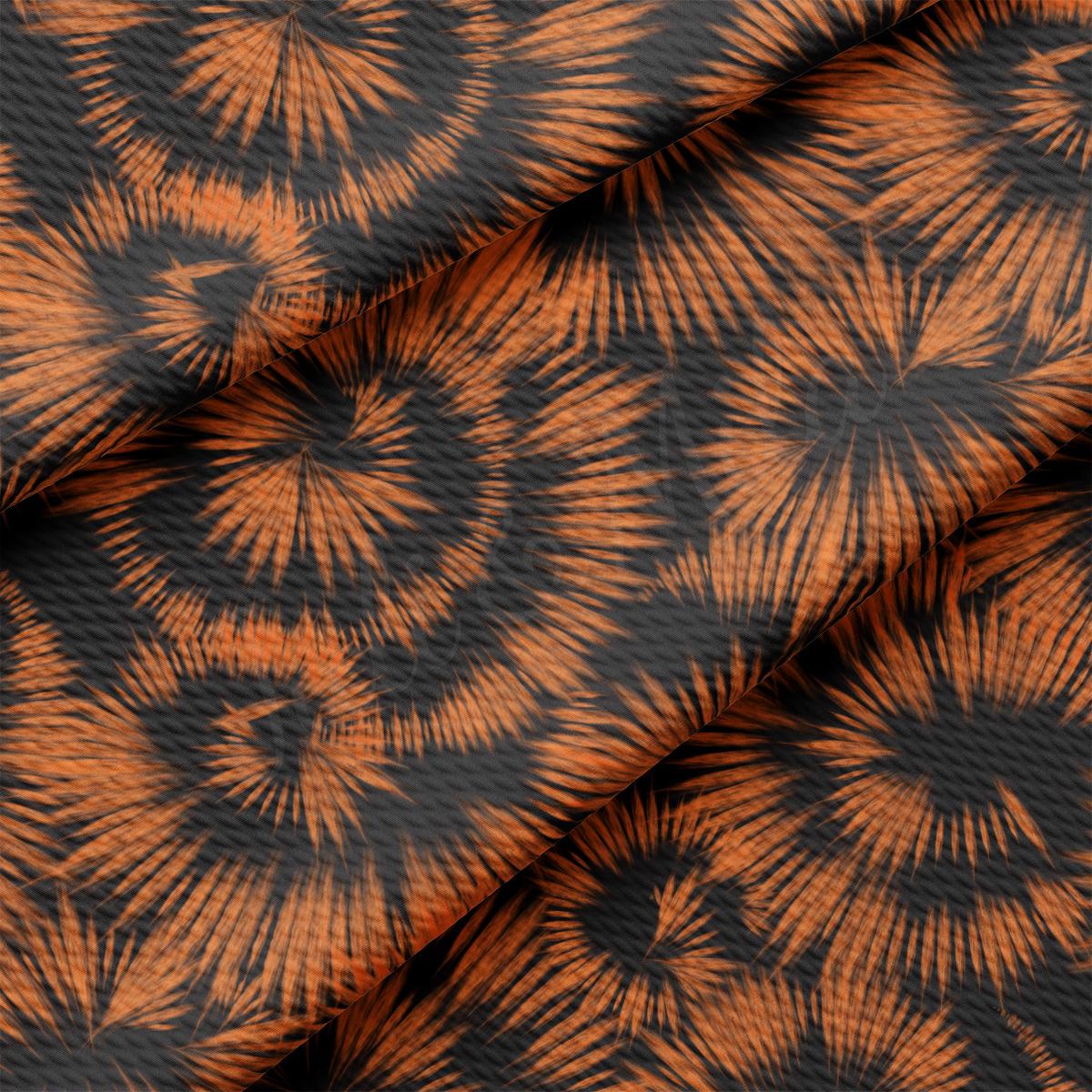 an orange and black pattern on a black background