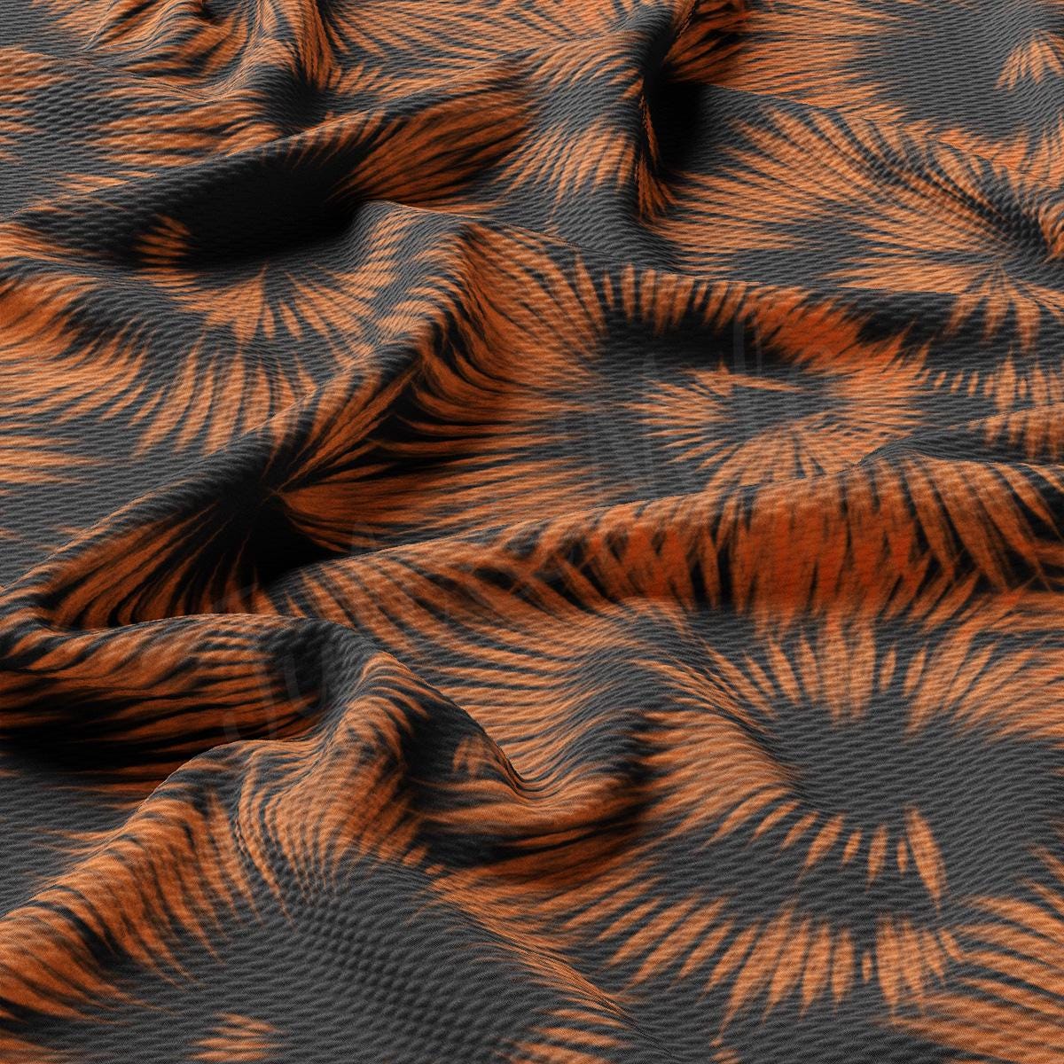 an orange and black pattern on a fabric