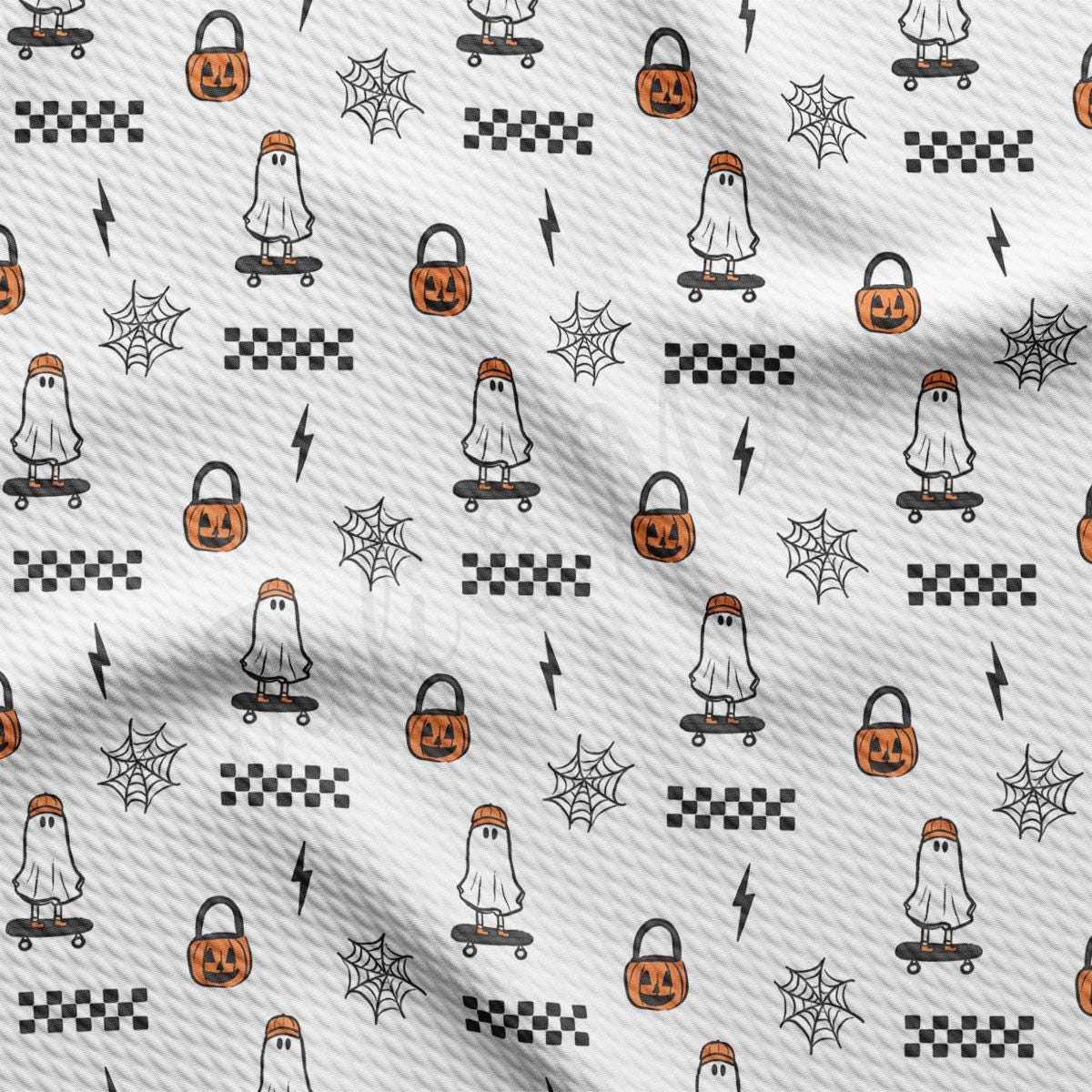 a white fabric with a pattern of halloween pumpkins and jack - o - lanterns