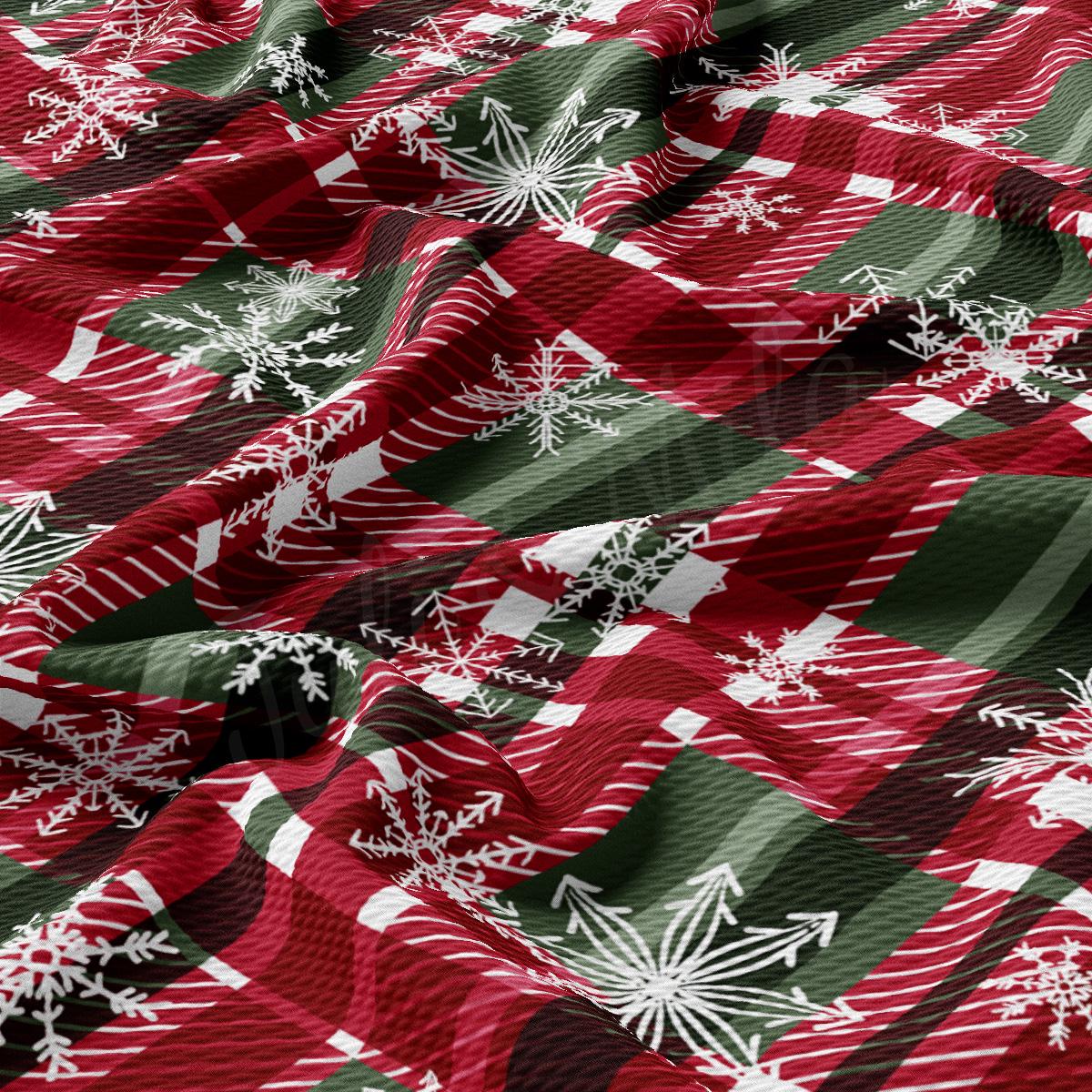 a red and green checkered fabric with snowflakes on it