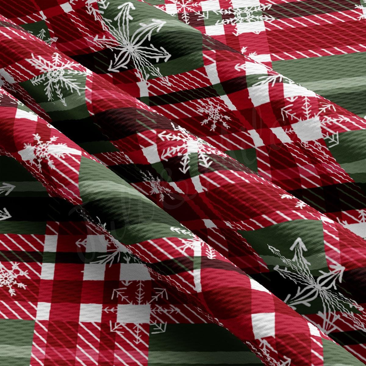 a red and green plaid pattern with snowflakes