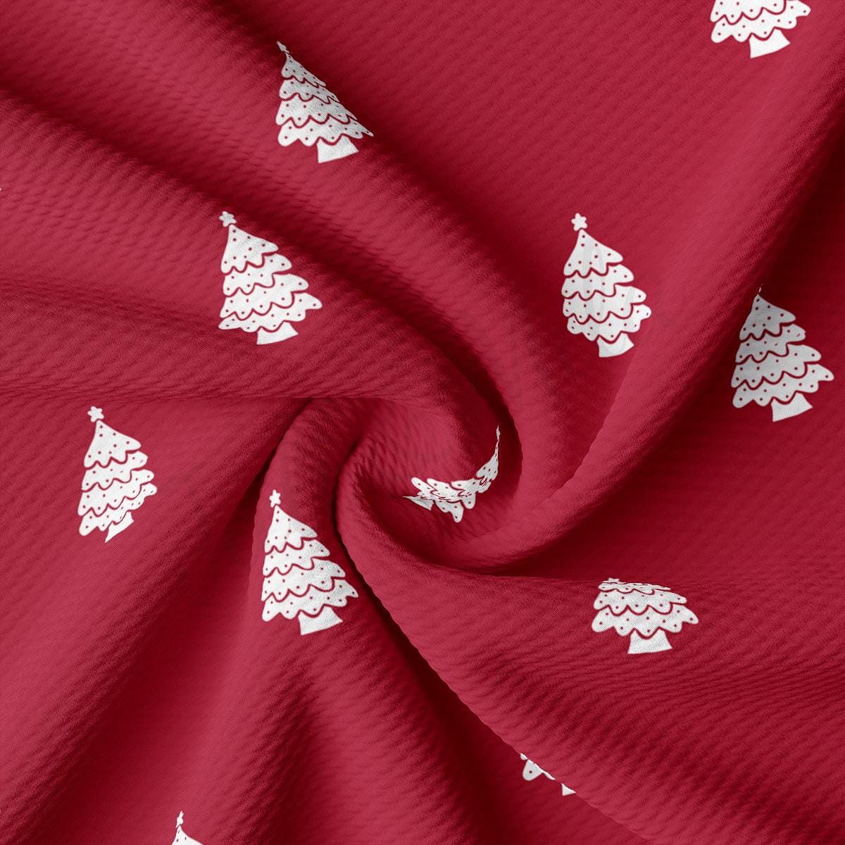 a red fabric with white christmas trees on it