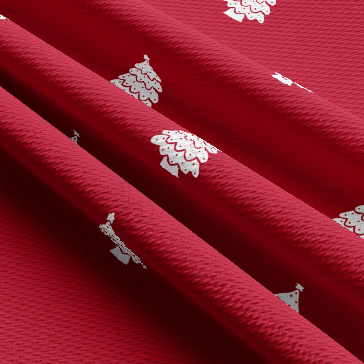 a close up of a red fabric with white designs