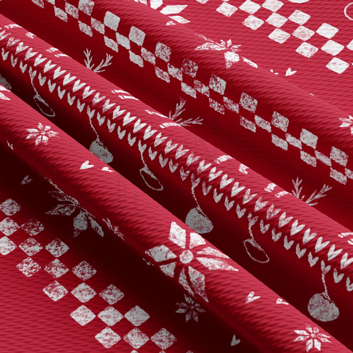 a close up of a red fabric with white designs