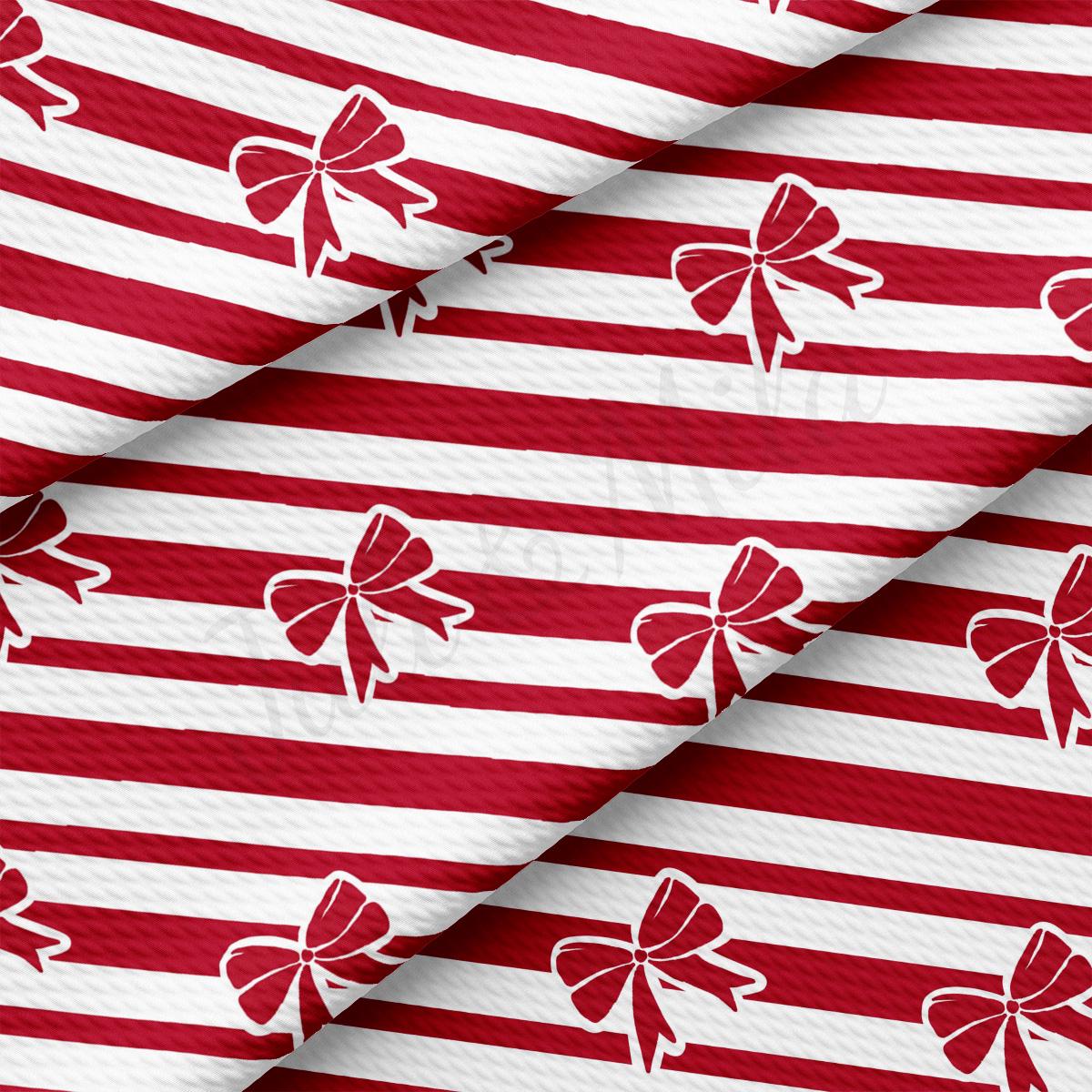 a red and white striped background with red and white bows