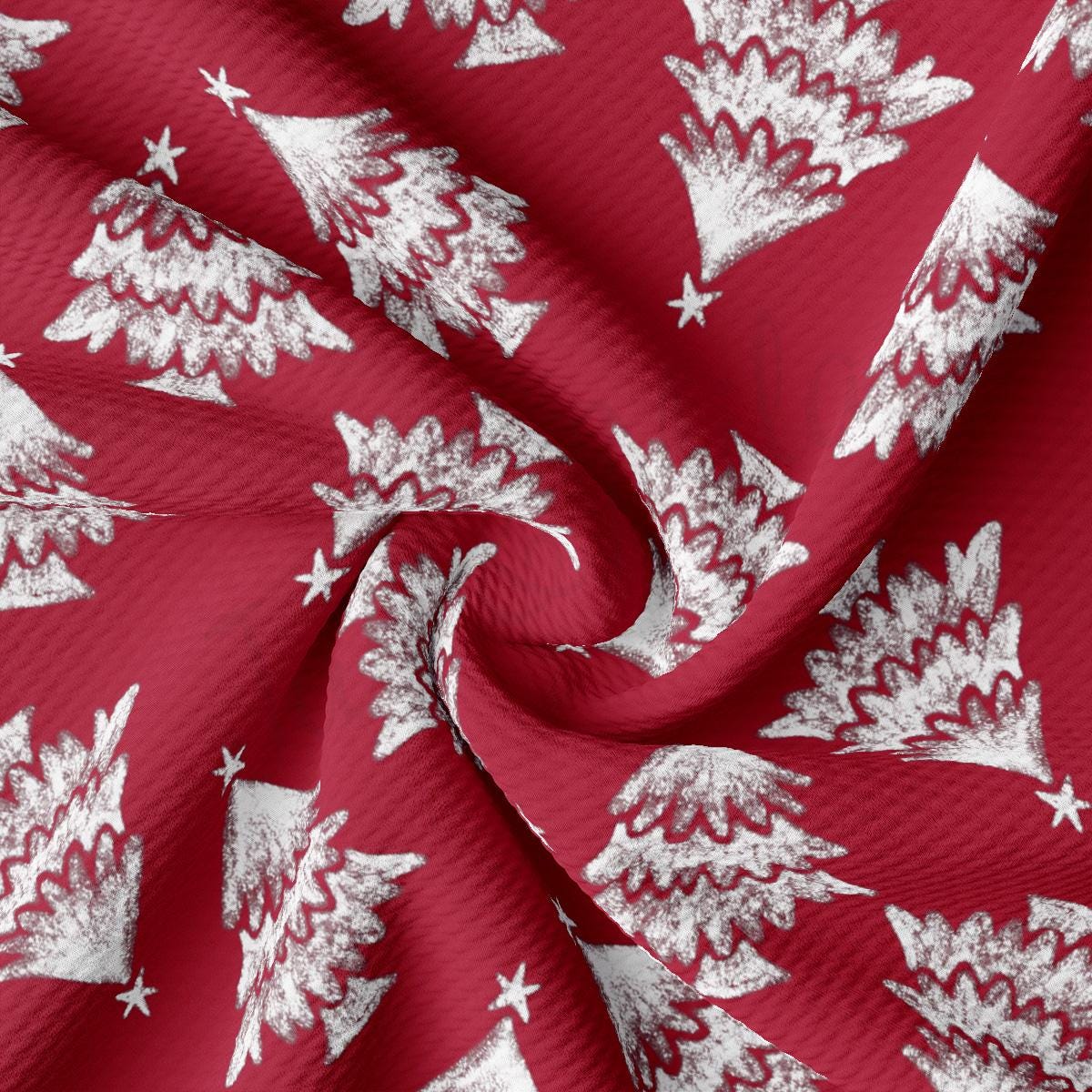 a red fabric with white christmas trees on it