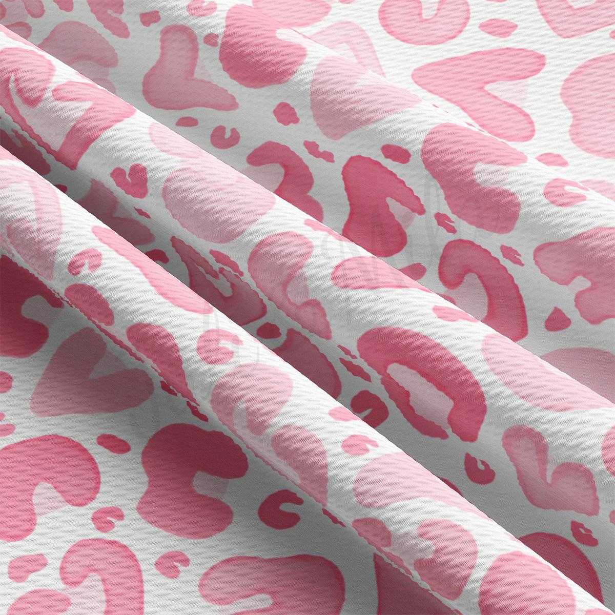 a pink and white animal print fabric