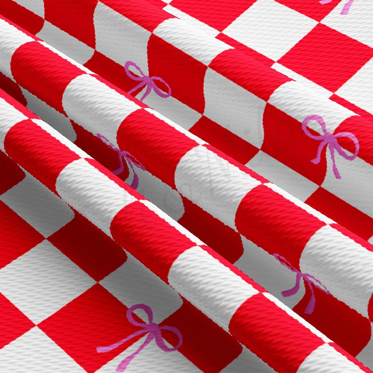 a red and white checkered table cloth with a bow