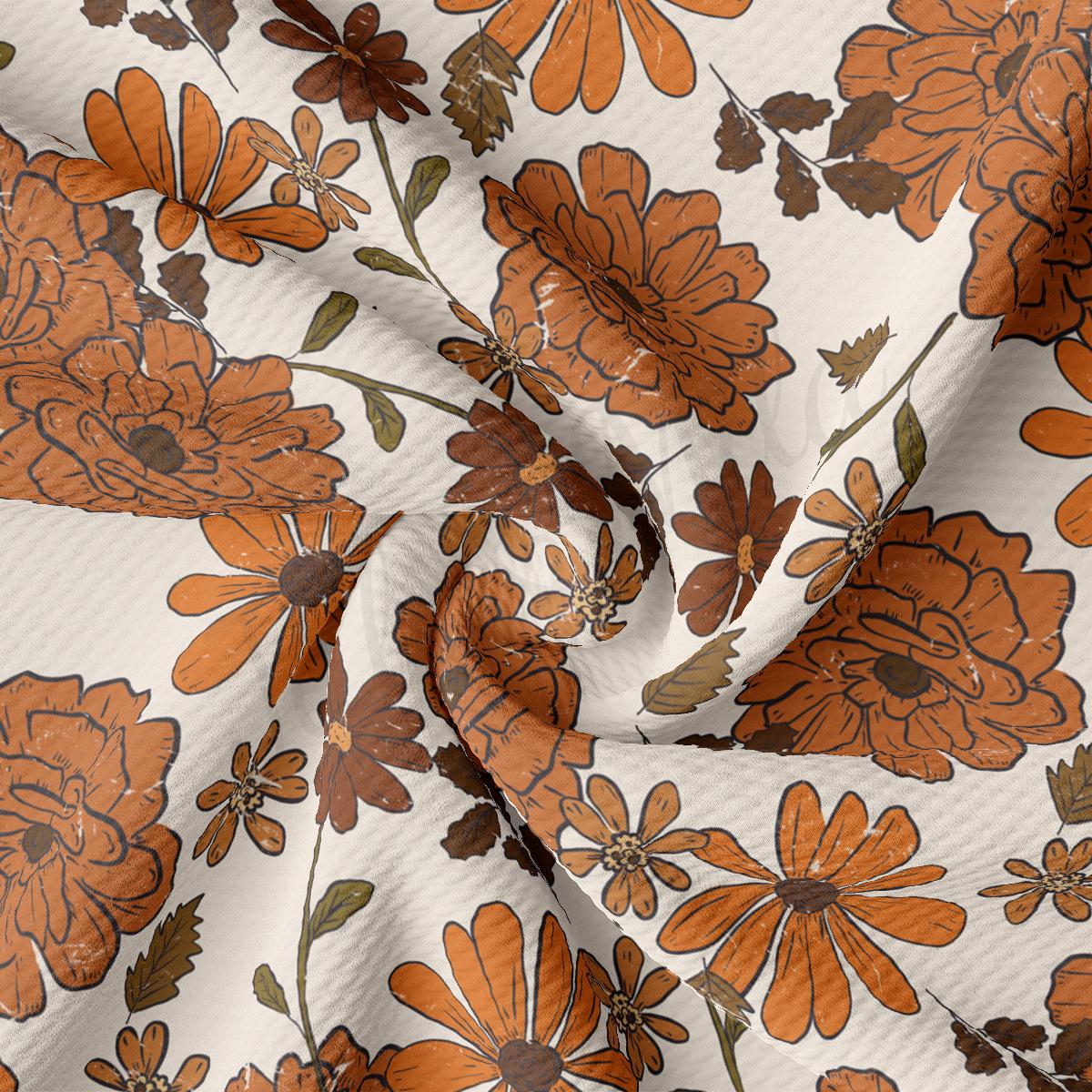 an orange and brown flower print on a white background