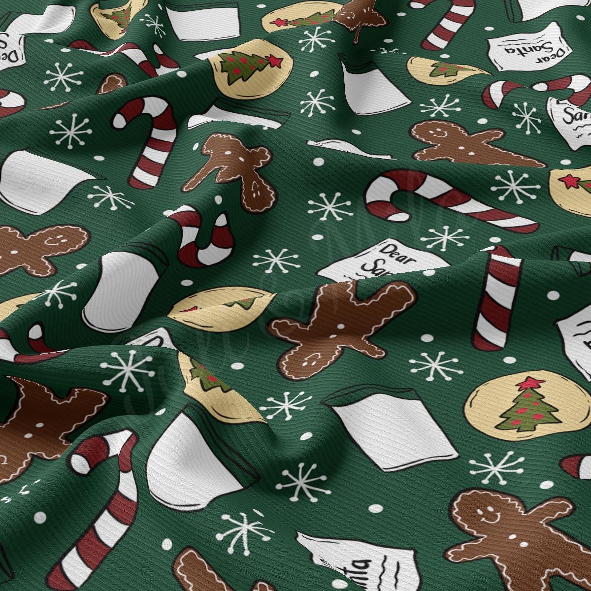 a green christmas wrapping with gingerbreads, cookies, and candy canes