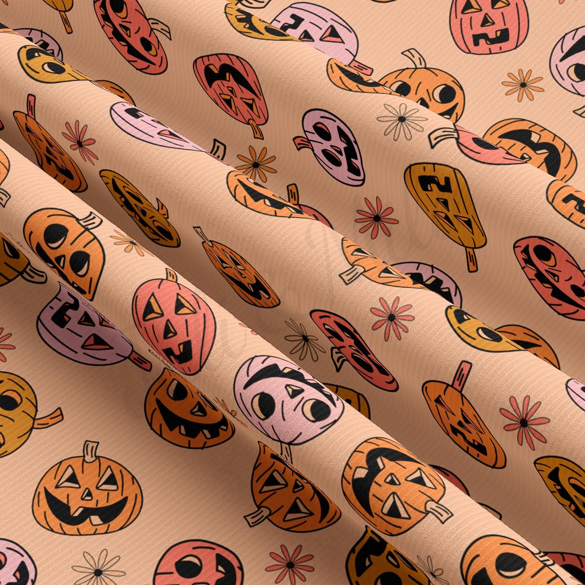 a pattern of pumpkins and faces on a pink background