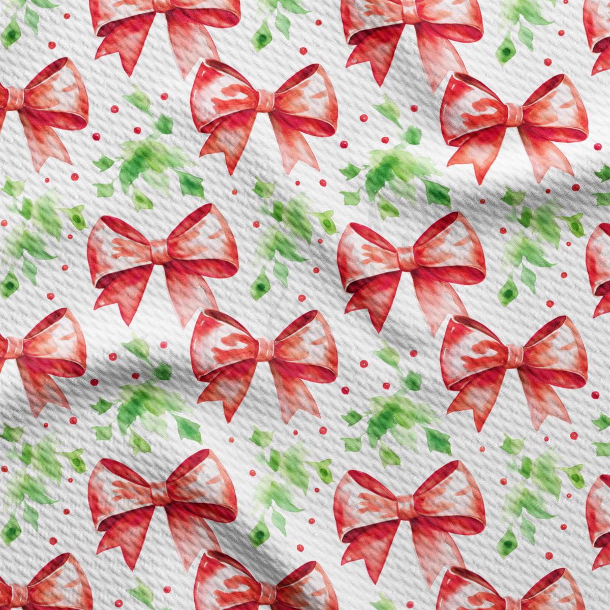 a pattern of red bows on a white background