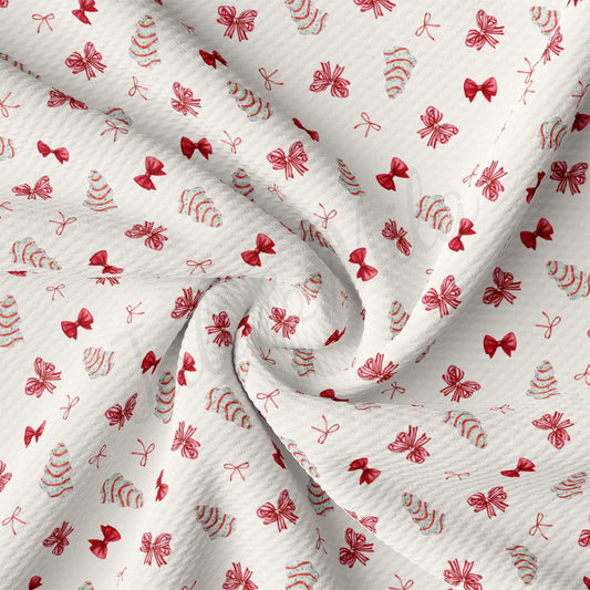 a close up of a white fabric with red flowers on it