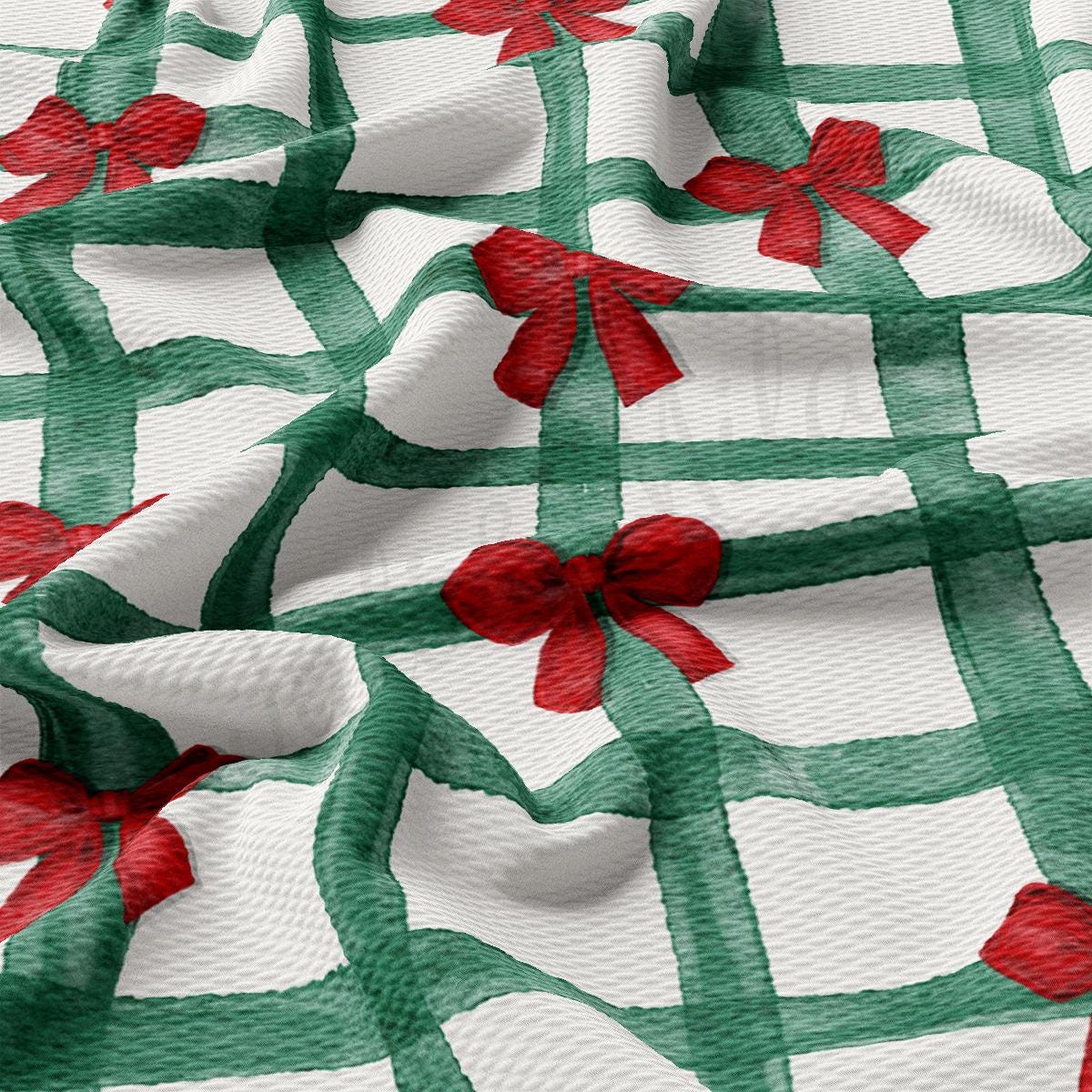 a green and white checkered fabric with red bows