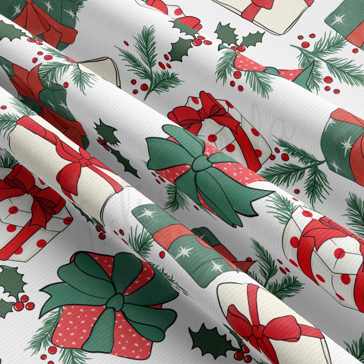 a christmas wrapping paper with holly and bells on it