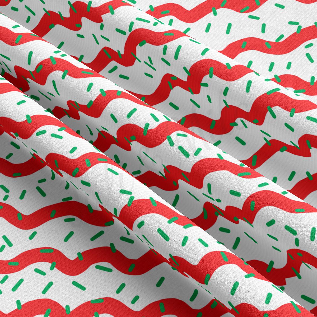 a red and white background with green sprinkles