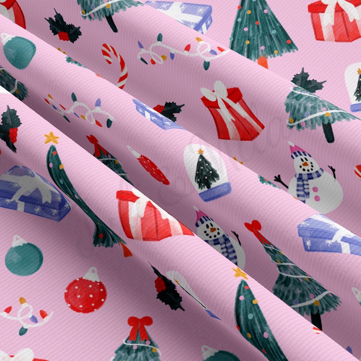 a pink wrapping paper with christmas trees and presents on it