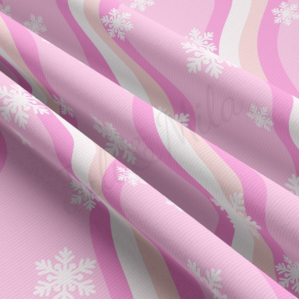 a pink and white snowflake pattern on a pink background