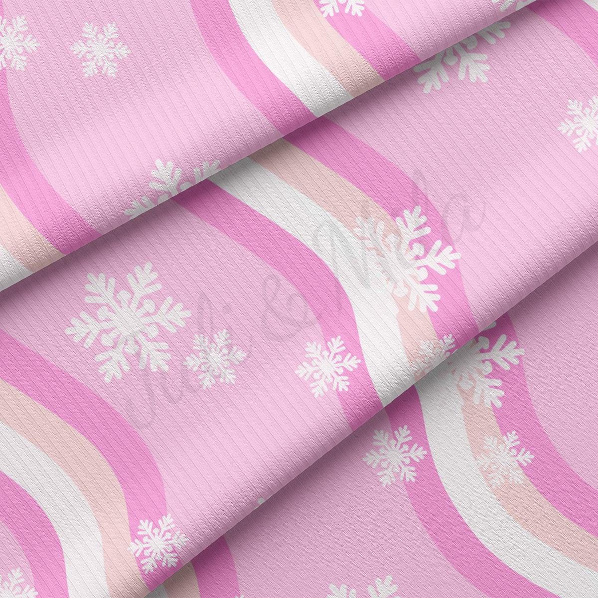 a pink background with white snowflakes on it