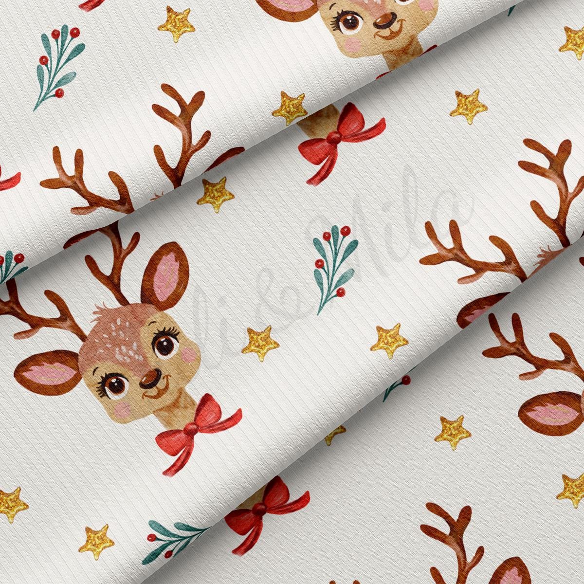 a close up of a white fabric with deer and stars on it