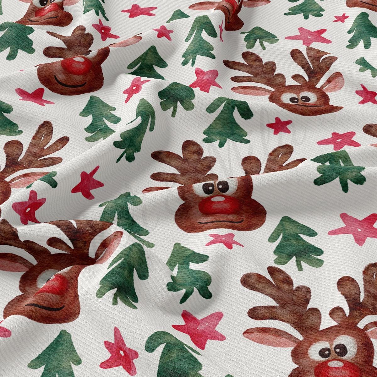 a close up of a white fabric with reindeers on it