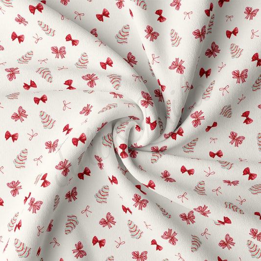 a red and white fabric with bows on it