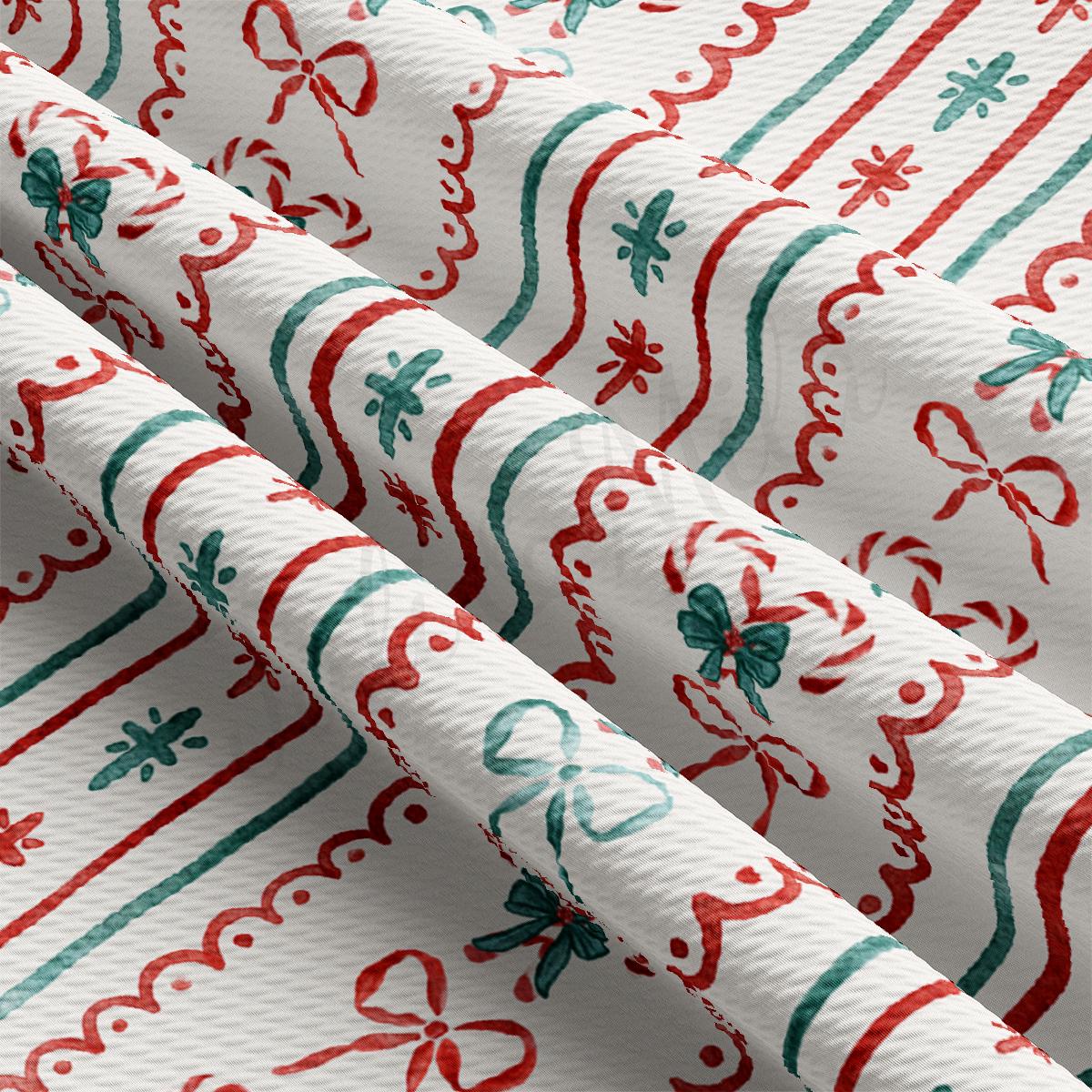 a close up of a red and green christmas wrapping paper